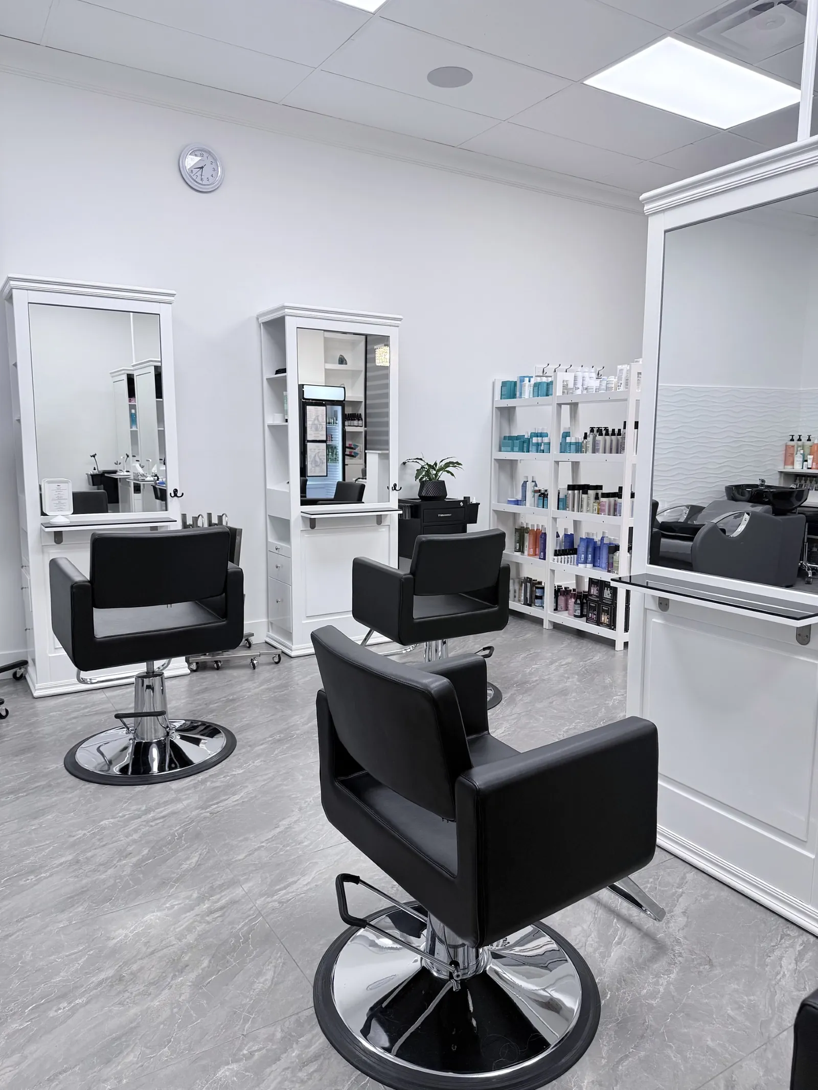 Styling chairs and mirrors inside Beyond Beauty Bar