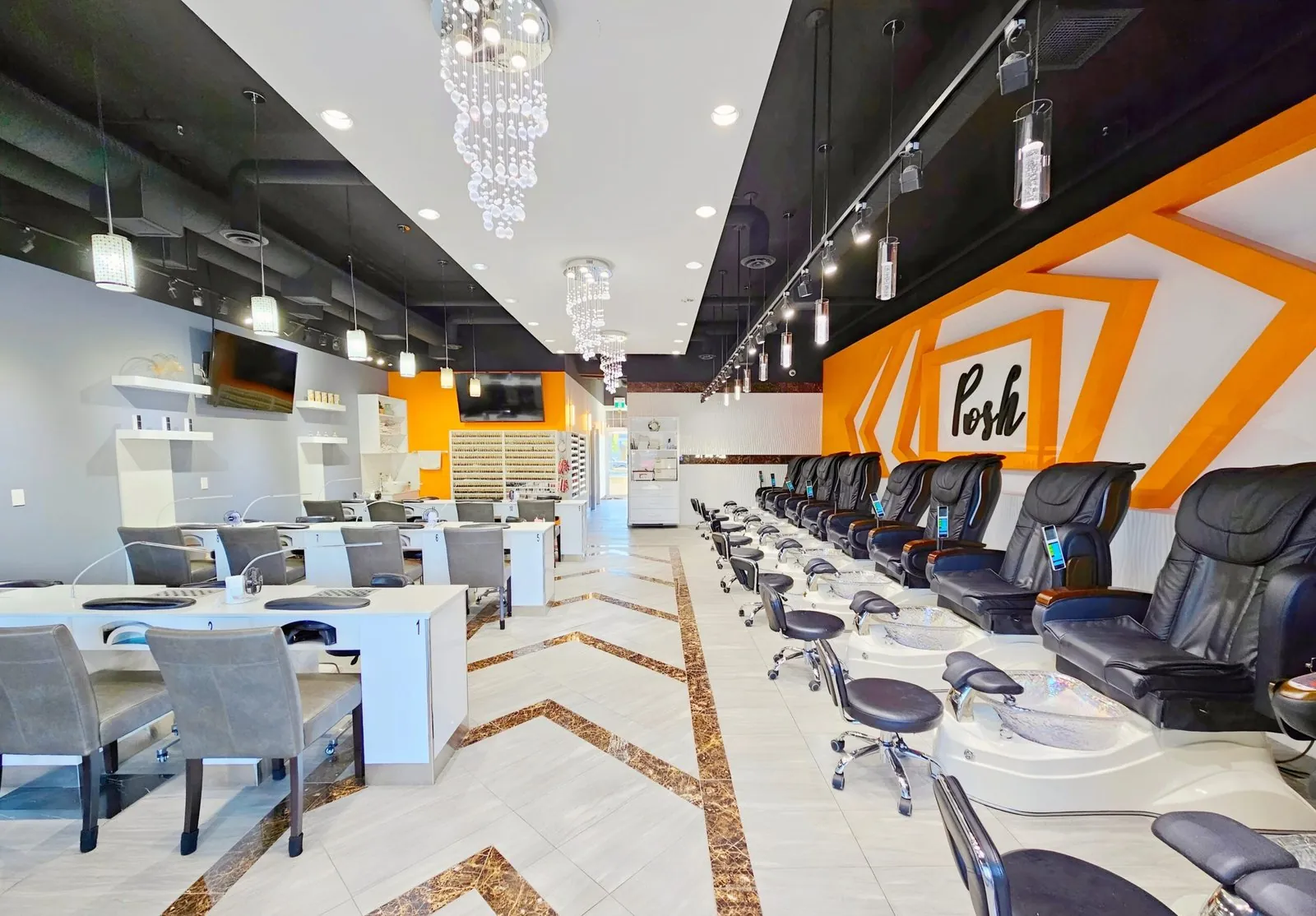 Manicure stations and pedicure chairs inside Posh Nails Spa